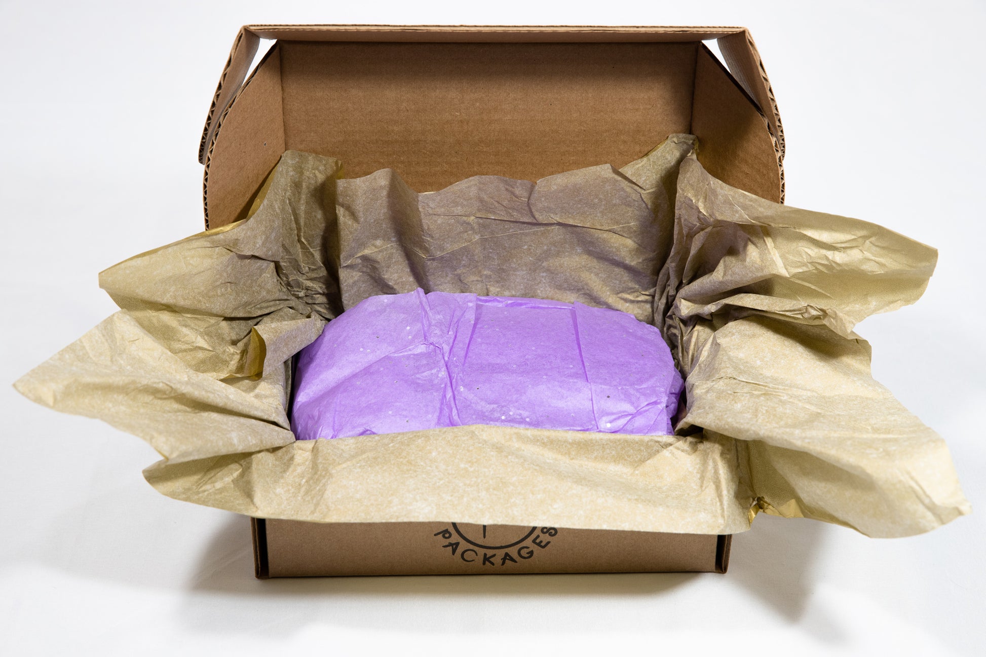 Beyond the gold tissue paper, the recipient discovers the amethyst gem stone tissue paper. The purple color is a subtle reminder that when we are in balance within, the Red (left) and Blue (right) sides of our brains naturally interoscillate creating the color purple!